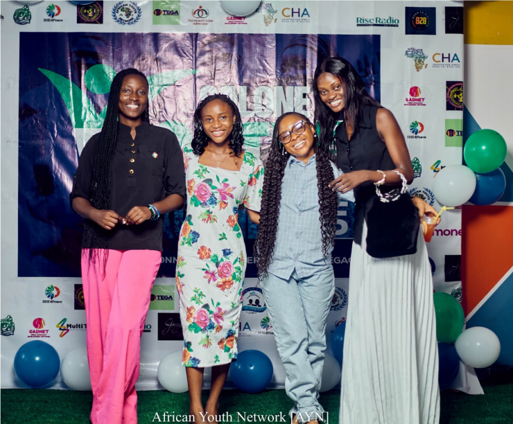 Four young women smiling at the Salone Youth Konnect 2025 photo wall