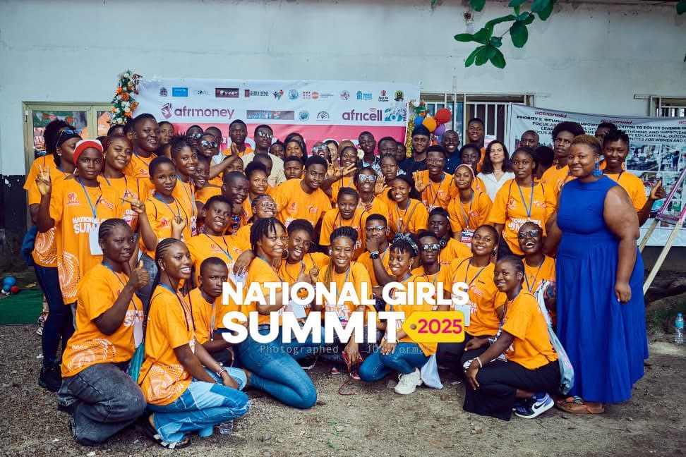 Second group of summit participants in orange t-shirts with partners at the National Girls Summit 2025